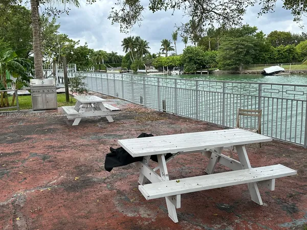 a view of a terrace with a table and chairs
