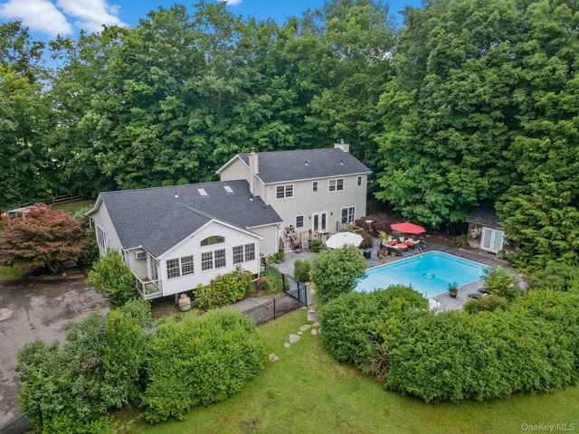 an aerial view of a house with a garden