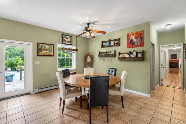 a dining room with furniture and window