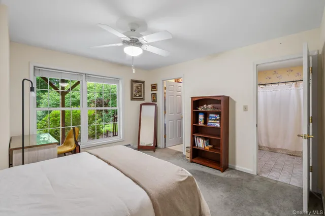 a bedroom with a large bed and a large window