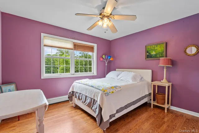 a bed room with a bed and a window