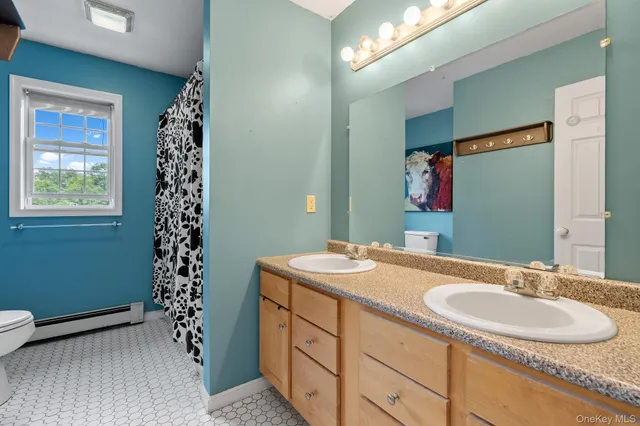 a bathroom with a sink a vanity and a mirror