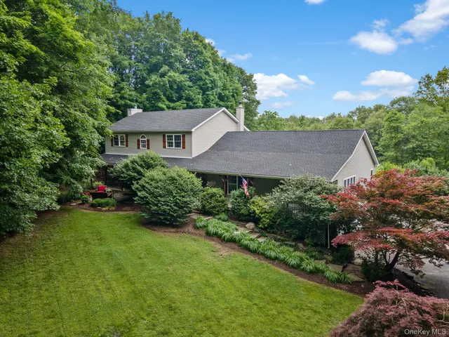a view of a garden with a house