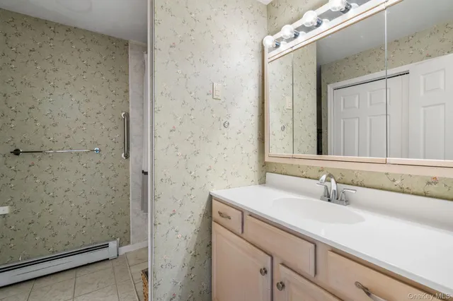 a bathroom with a sink and a mirror