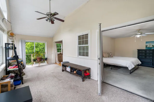 a view of a livingroom with furniture and a window