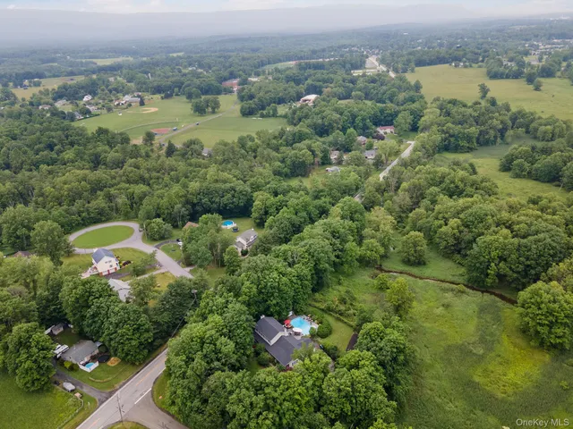 an aerial view of a house with an outdoor space