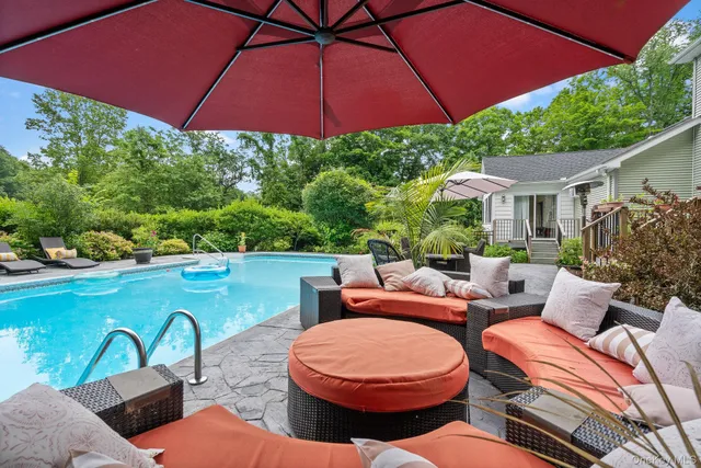 an outdoor space with furniture and umbrella