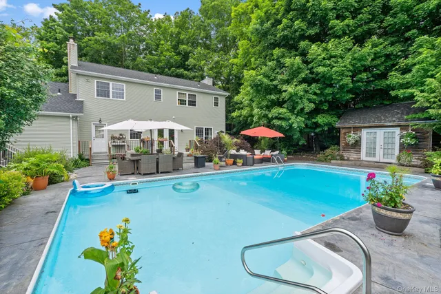 a view of a swimming pool with a patio
