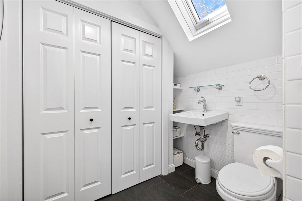 16 Primrose Street, Unit 3 Boston, MA 02131 - Photo 12 of 26 a bathroom with a sink a toilet and shower