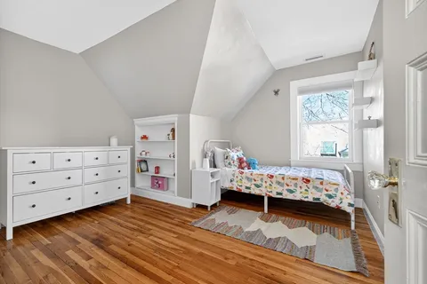 a bed room with a bed and a window
