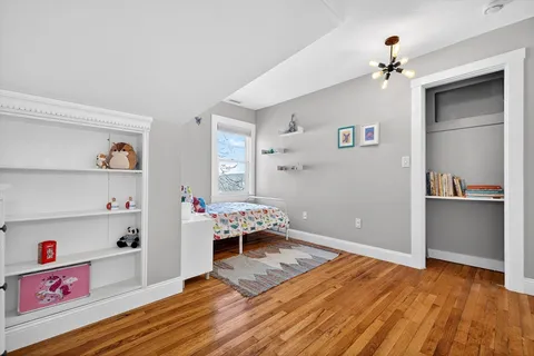 a living room with hard wood floors and a couch