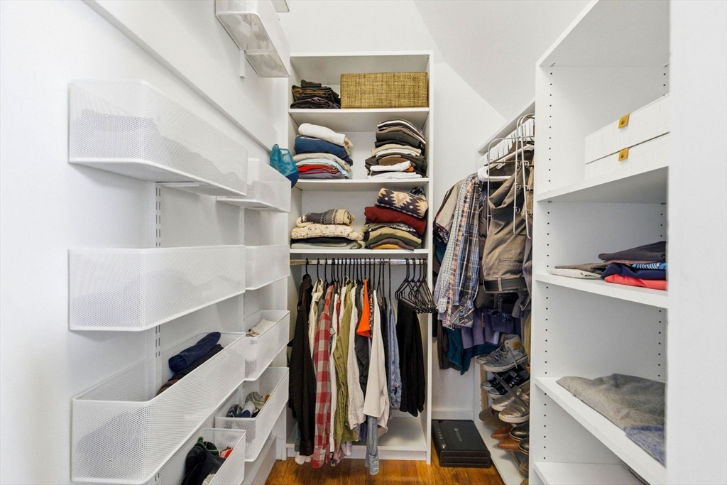 16 Primrose Street, Unit 3 Boston, MA 02131 - Photo 17 of 26 a view of walk in closet with clothes and shoes