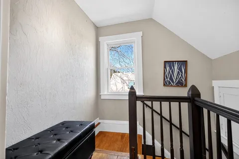 a view of a hallway with windows