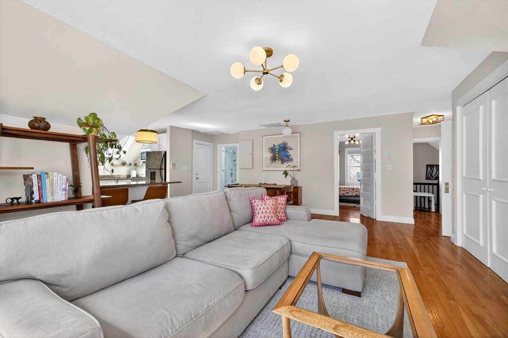 16 Primrose Street, Unit 3 Boston, MA 02131 - Photo 4 of 26 a living room with furniture and wooden floor