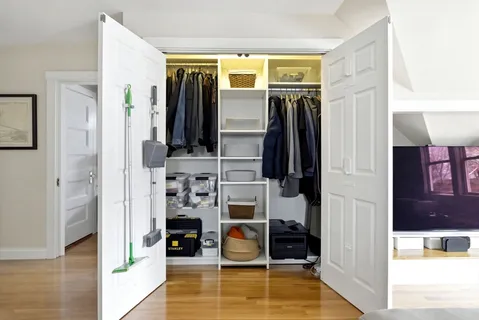 a view of walk in closet with living room