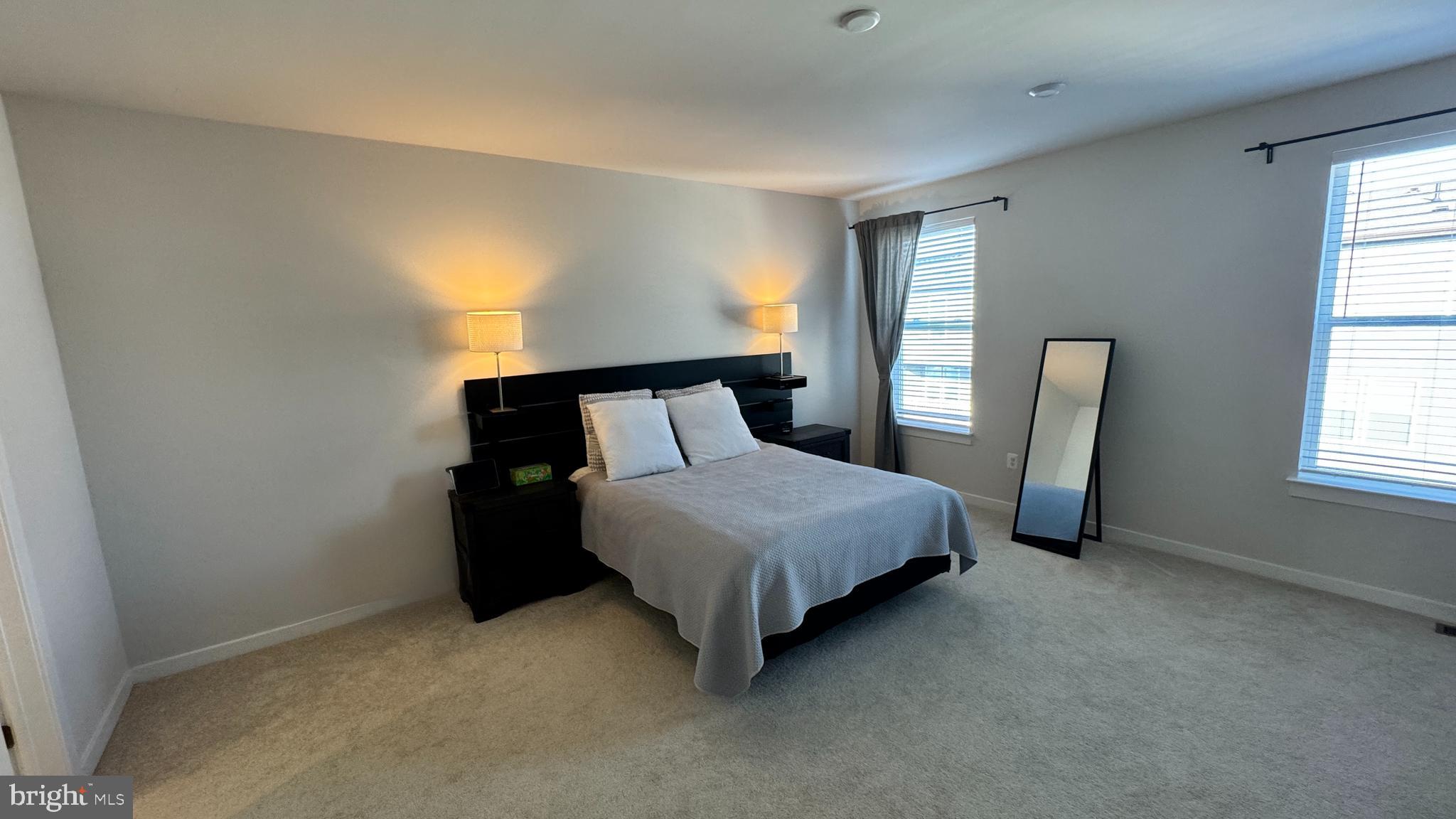14124 Gypsum Loop, Unit 70 Chantilly, VA 20151 - Photo 19 of 24 a bedroom with a bed and window