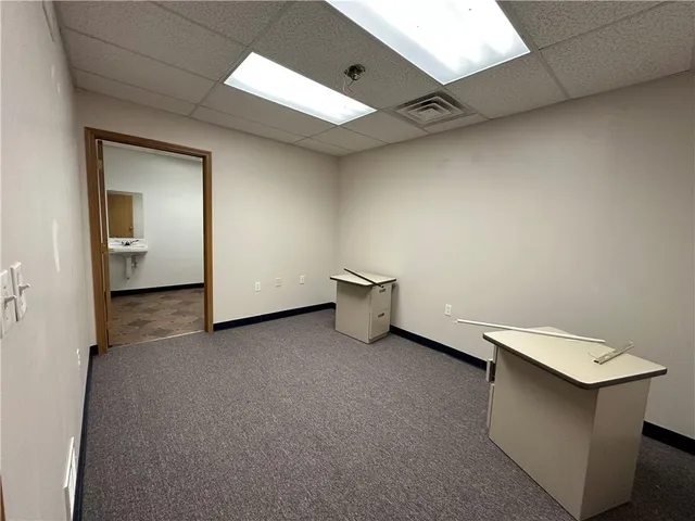 a view of a hallway to the room