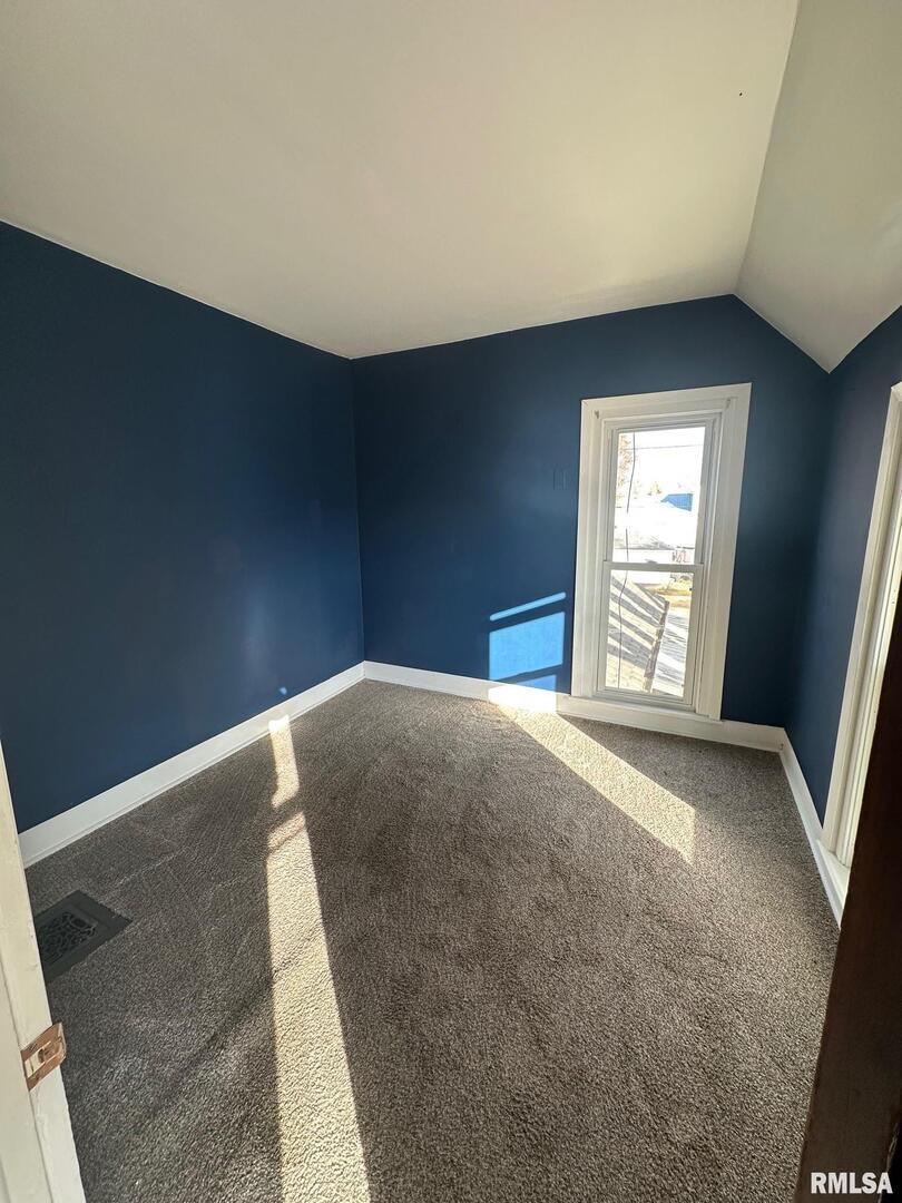 323 Lincoln Street Miles, IA 52064 - Photo 17 of 34 an empty room with windows