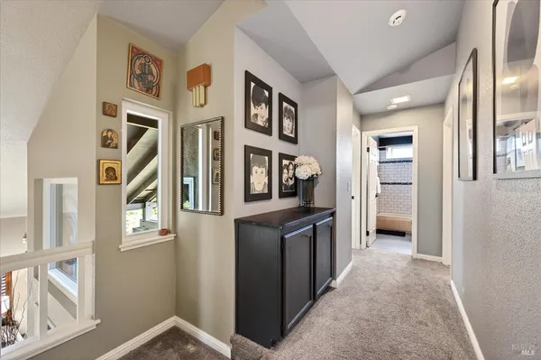 a view of an entryway with wooden floor