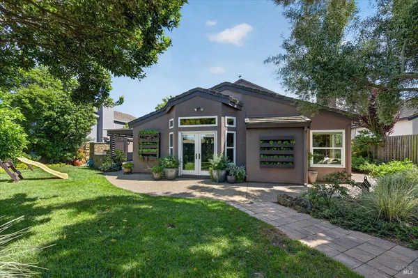 a front view of a house with a yard and porch