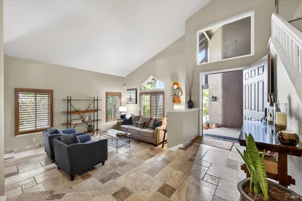 a living room with furniture and a window