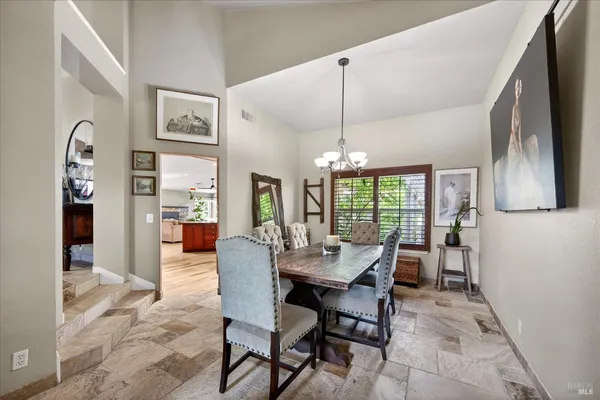 a view of a dining room with furniture window and outside view