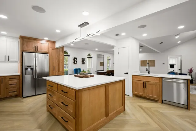 a view of kitchen with center island and living room