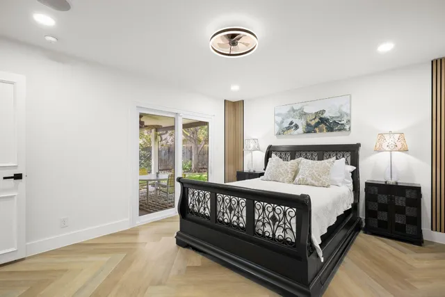 a spacious bedroom with a bed and a walk in closet