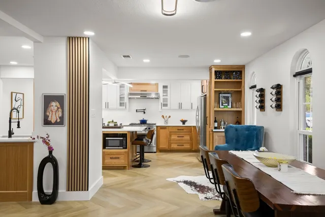 a view of a dining room with furniture and window