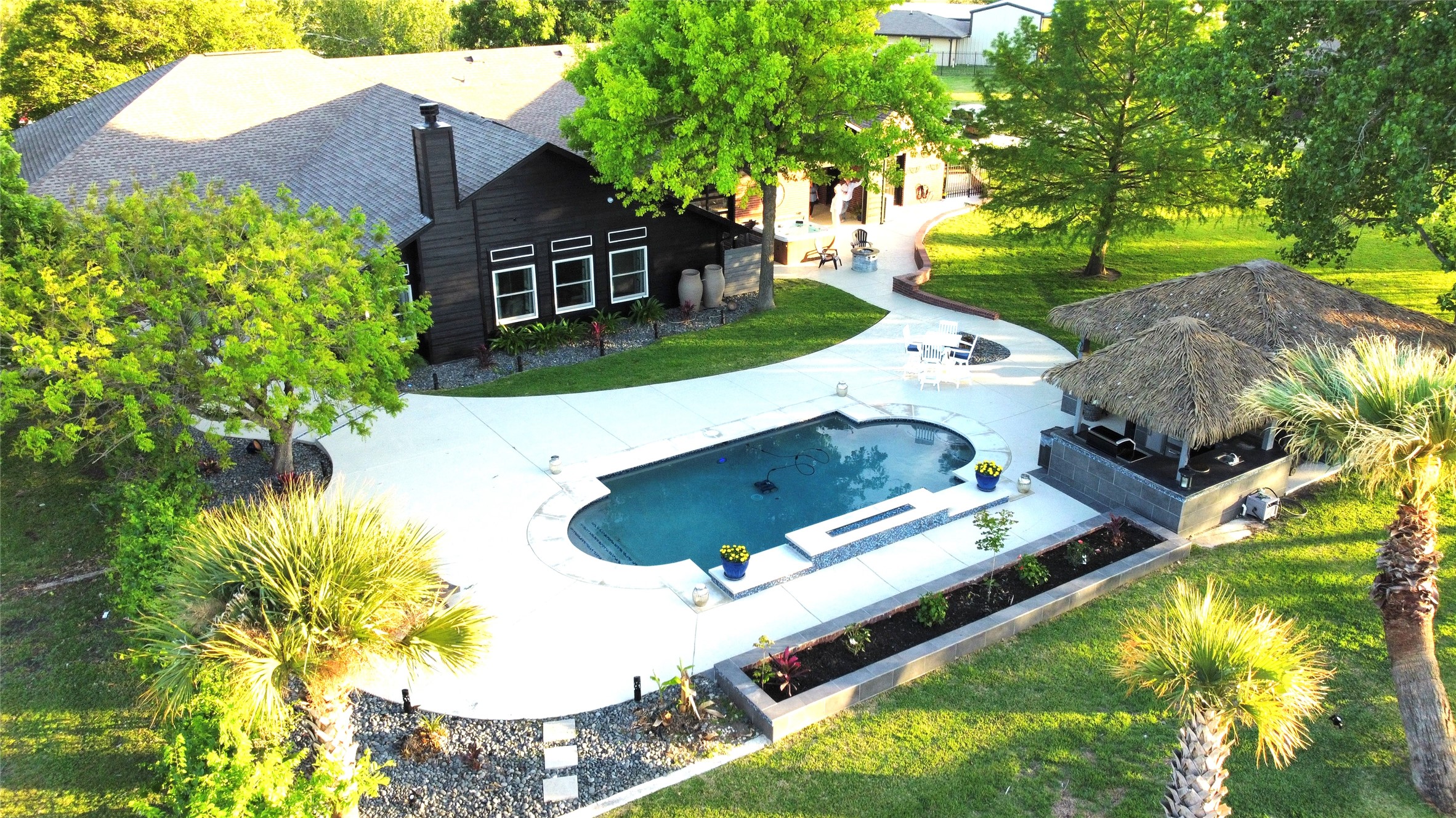 1902 Rowe Loop Pflugerville, TX 78660 - Photo 35 of 38 an aerial view of a house with swimming pool and large trees