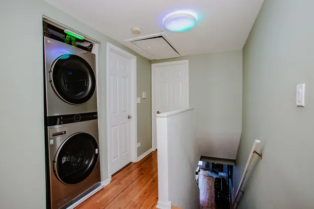 a view of a hallway with washer and dryer