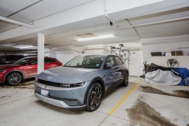 a car and bike parked in a garage