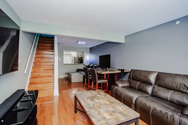 a living room with furniture and a flat screen tv