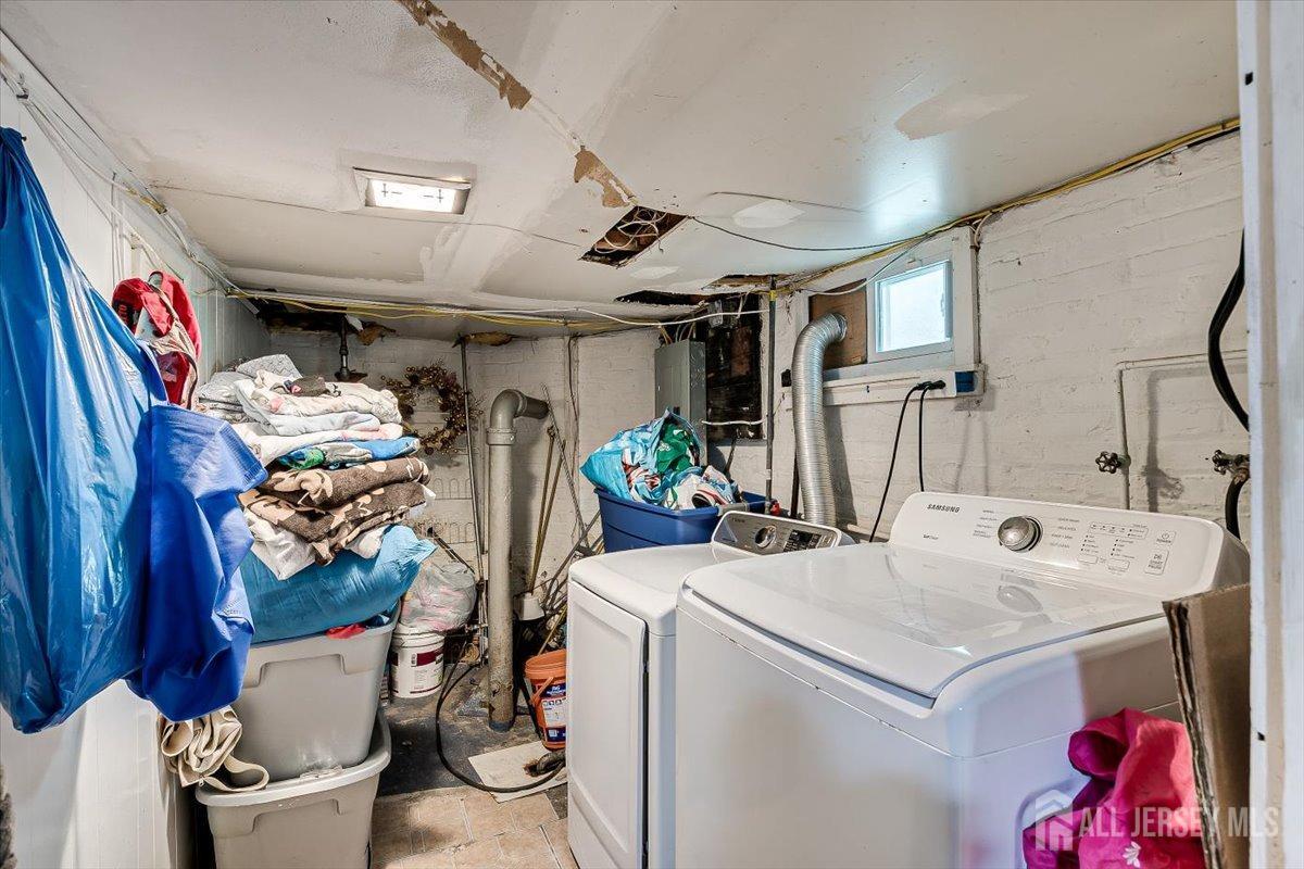 438 Lawrie Street Perth Amboy, NJ 08861 - Photo 36 of 49 a utility room with dryer and washer