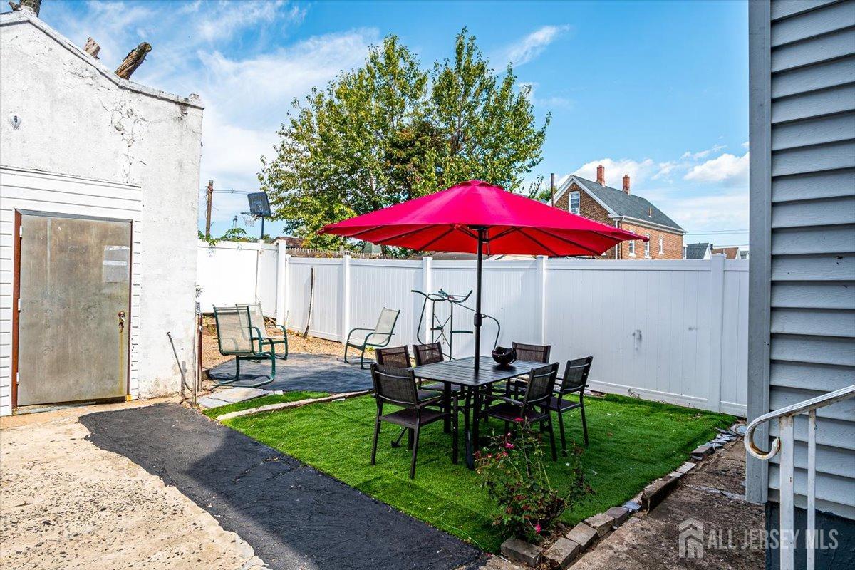 438 Lawrie Street Perth Amboy, NJ 08861 - Photo 37 of 49 a view of outdoor space yard deck patio and outdoor kitchen