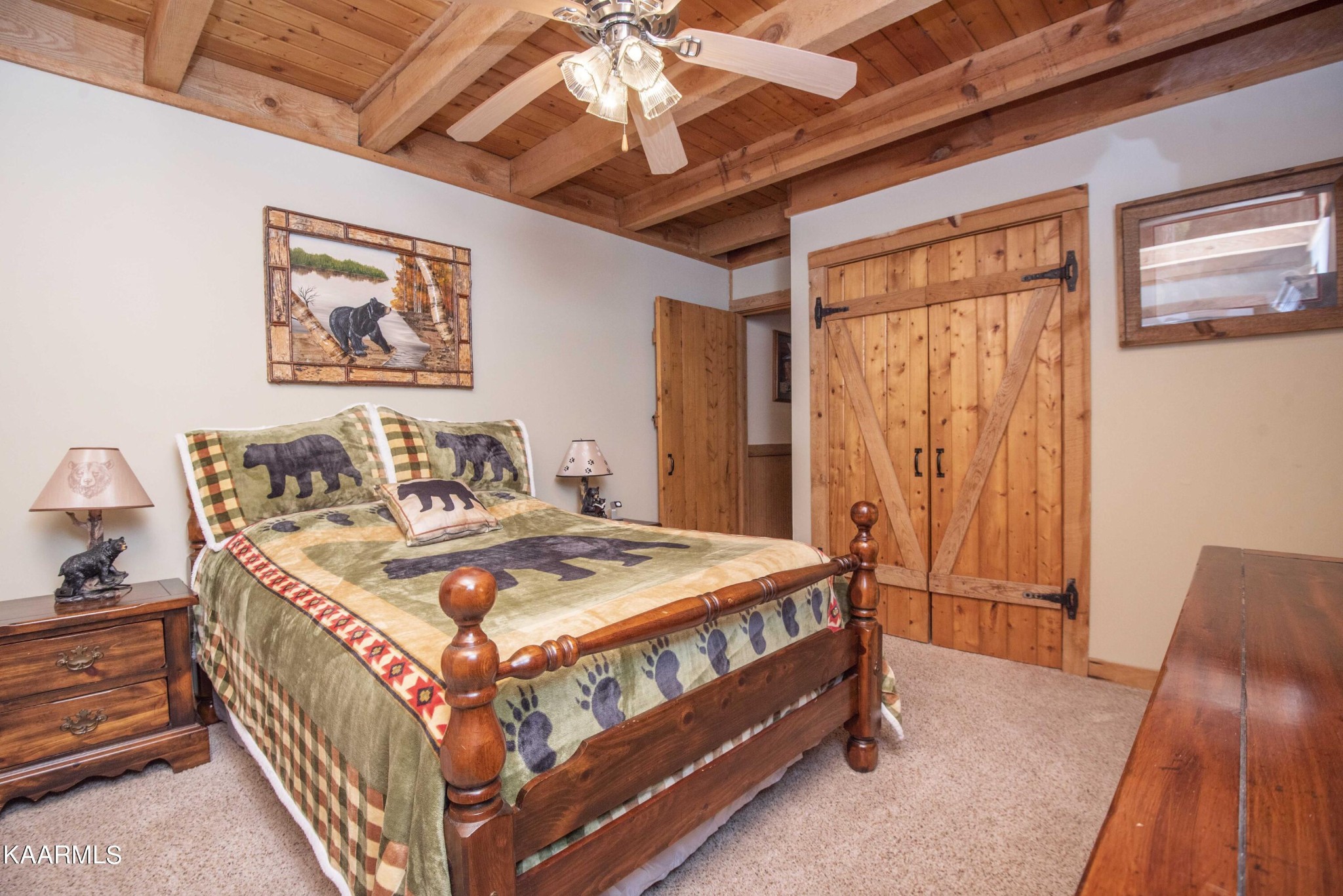 106 Club View Road Townsend, TN 37882 - Photo 23 of 55 a bedroom with a bed and a chandelier
