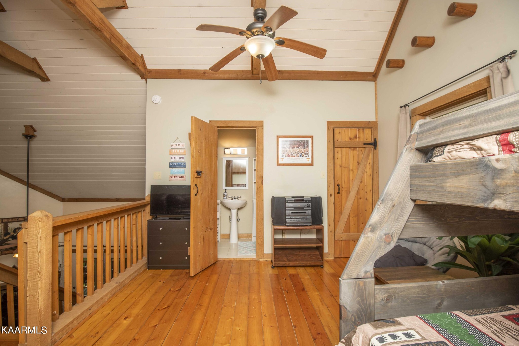 106 Club View Road Townsend, TN 37882 - Photo 31 of 55 a view of a hallway with wooden floor and furniture