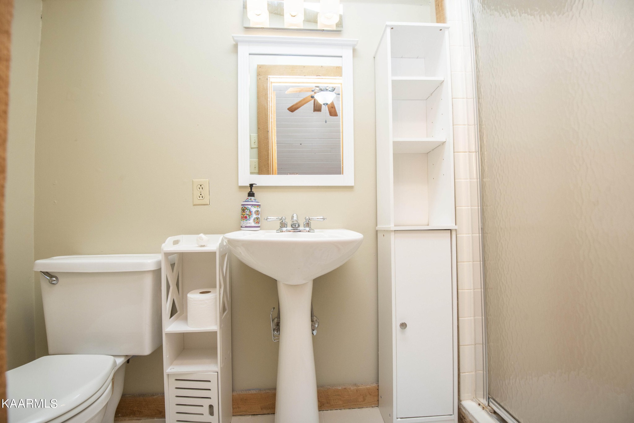 106 Club View Road Townsend, TN 37882 - Photo 33 of 55 a bathroom with a sink toilet and mirror