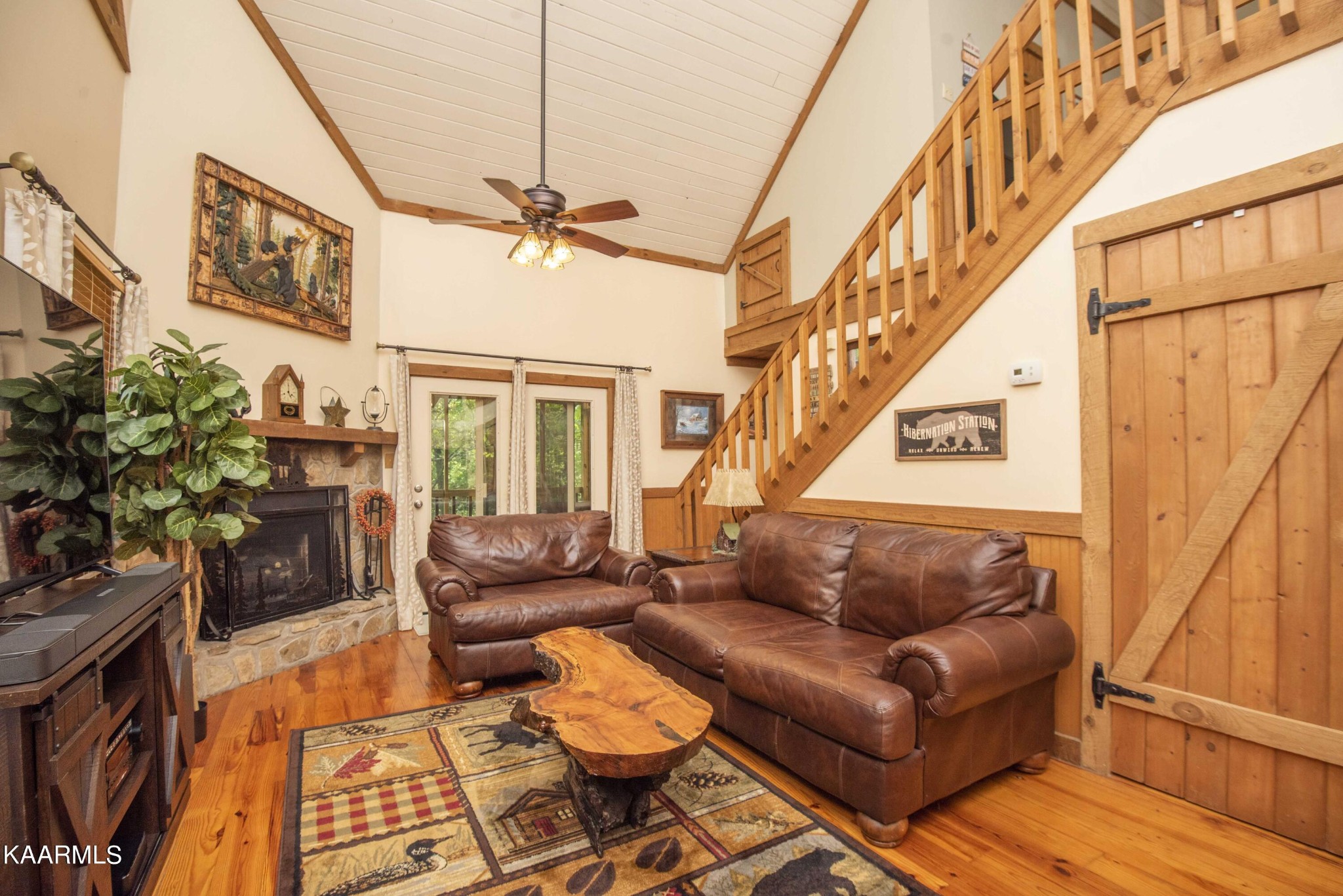 106 Club View Road Townsend, TN 37882 - Photo 6 of 55 a living room with furniture and a chandelier