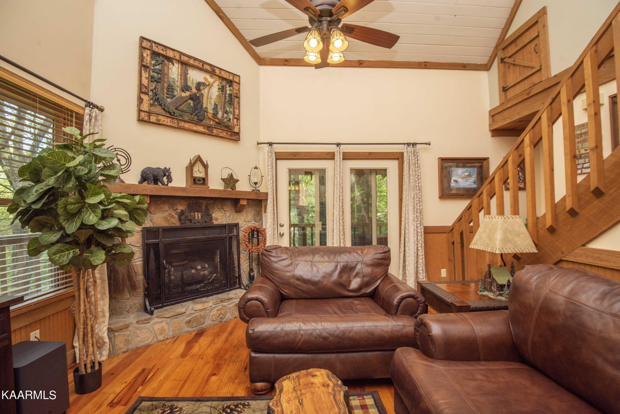 106 Club View Road Townsend, TN 37882 - Photo 7 of 55 a living room with furniture a fireplace and a chandelier