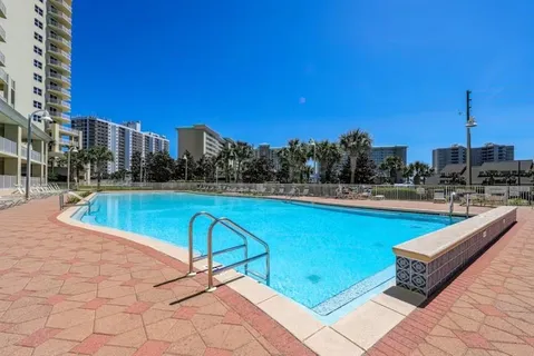 a view of a swimming pool with a terrace
