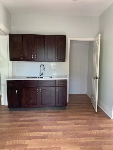 a kitchen with a sink and cabinets