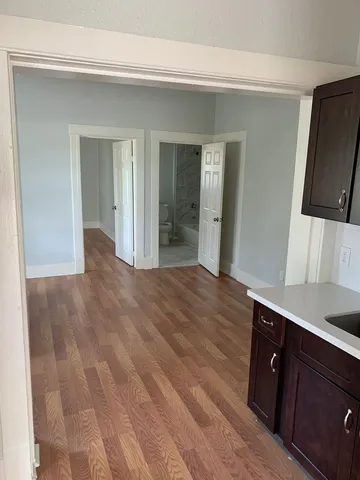 a view of a kitchen from the hallway