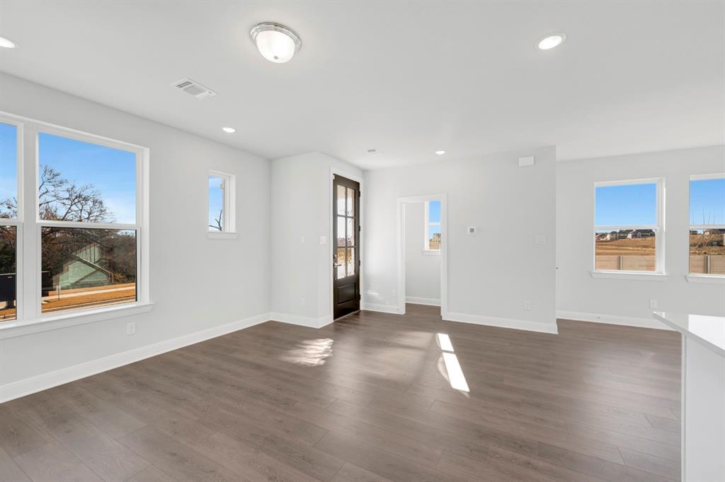 3501 Pineda Way McKinney, TX 75071 - Photo 11 of 40 wooden floor in an empty room with a window