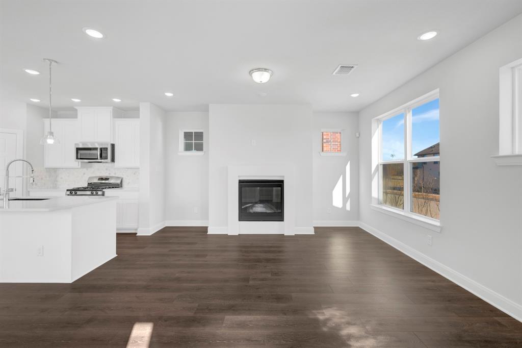 3501 Pineda Way McKinney, TX 75071 - Photo 12 of 40 a view of kitchen with cabinets and wooden floor