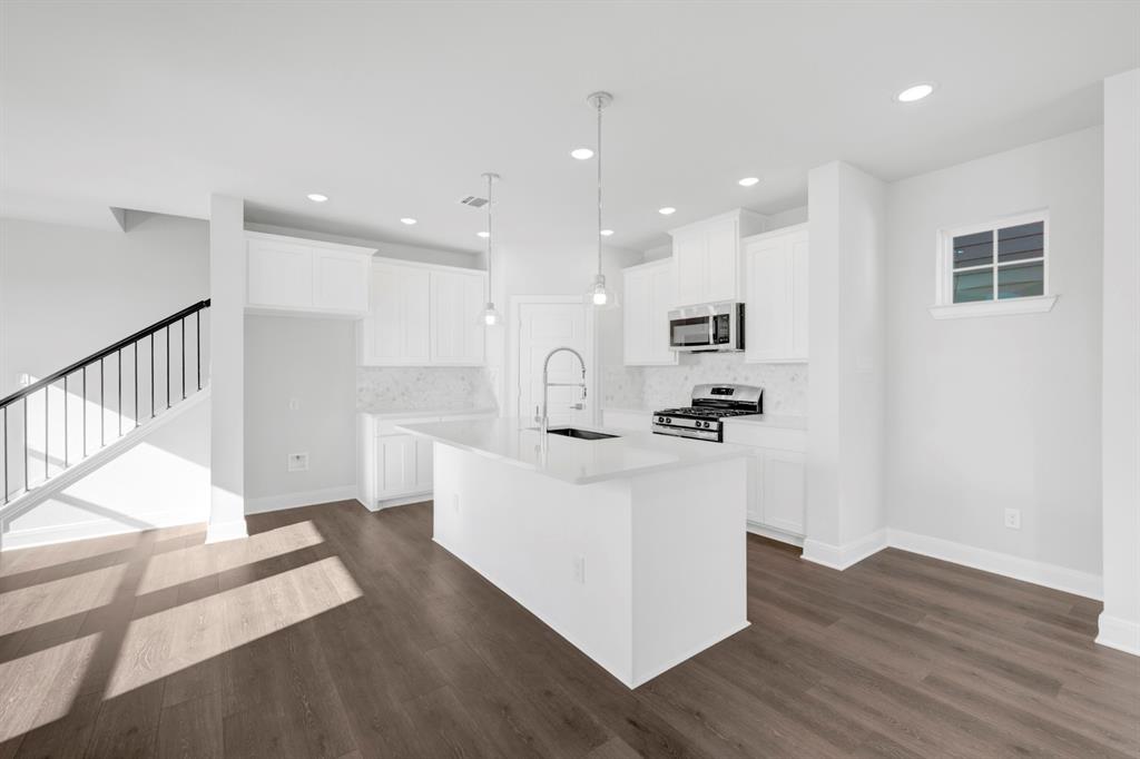 3501 Pineda Way McKinney, TX 75071 - Photo 18 of 40 a view of kitchen with wooden floor and electronic appliances