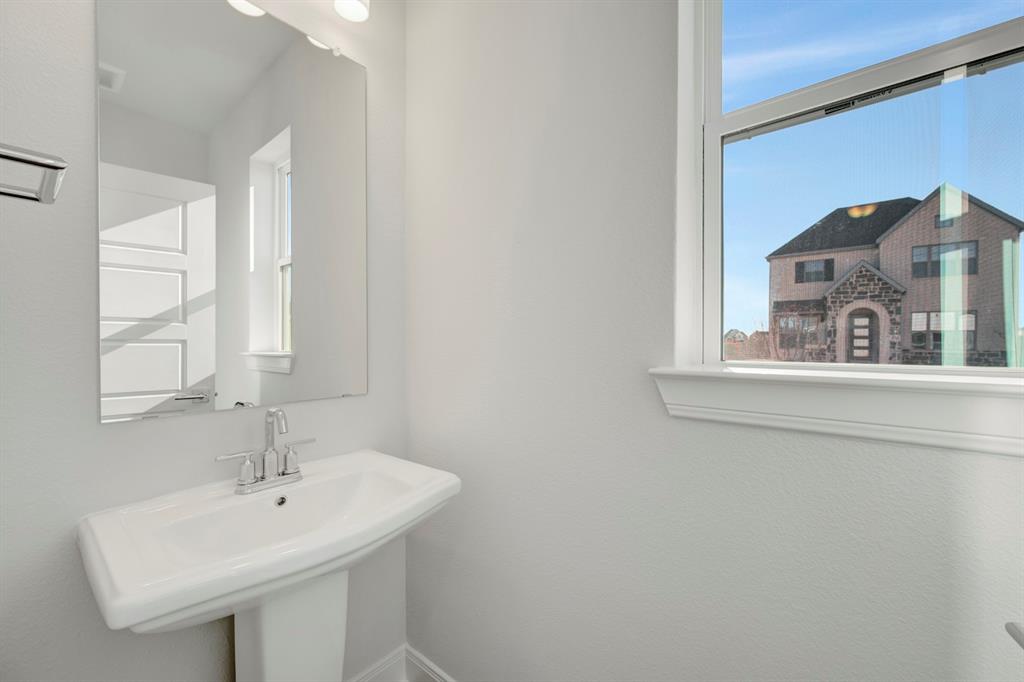 3501 Pineda Way McKinney, TX 75071 - Photo 27 of 40 a bathroom with a sink and a mirror