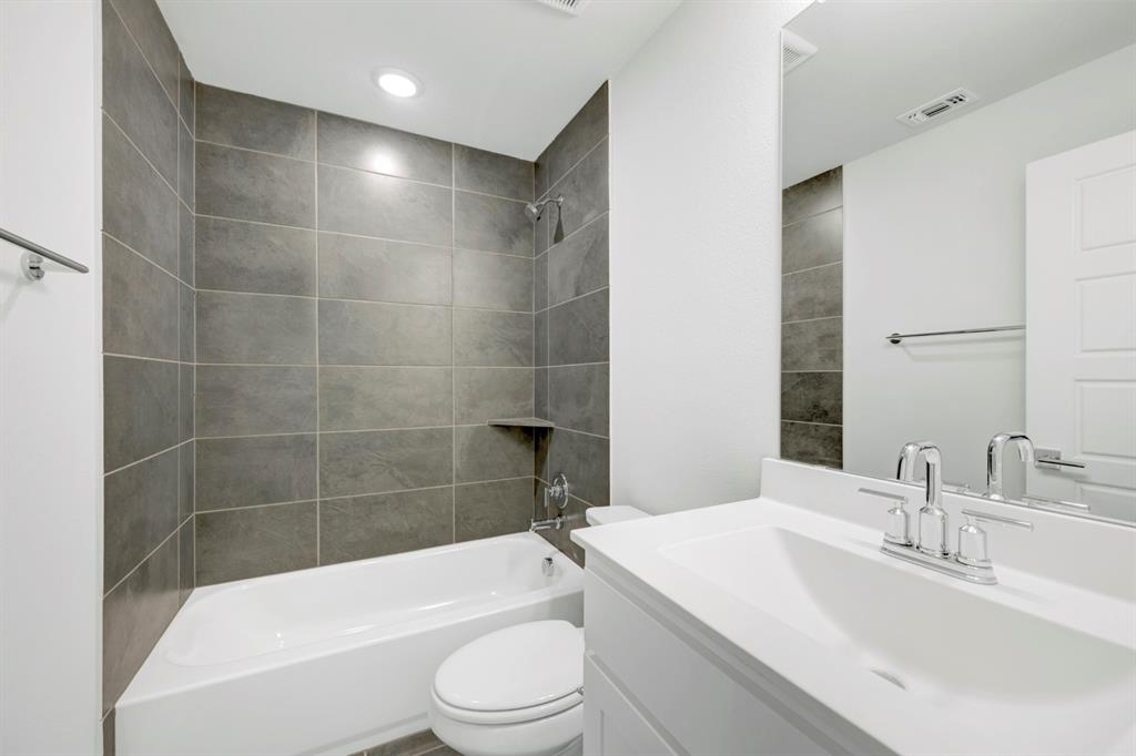 3501 Pineda Way McKinney, TX 75071 - Photo 34 of 40 a bathroom with a bathtub a sink a toilet and a mirror
