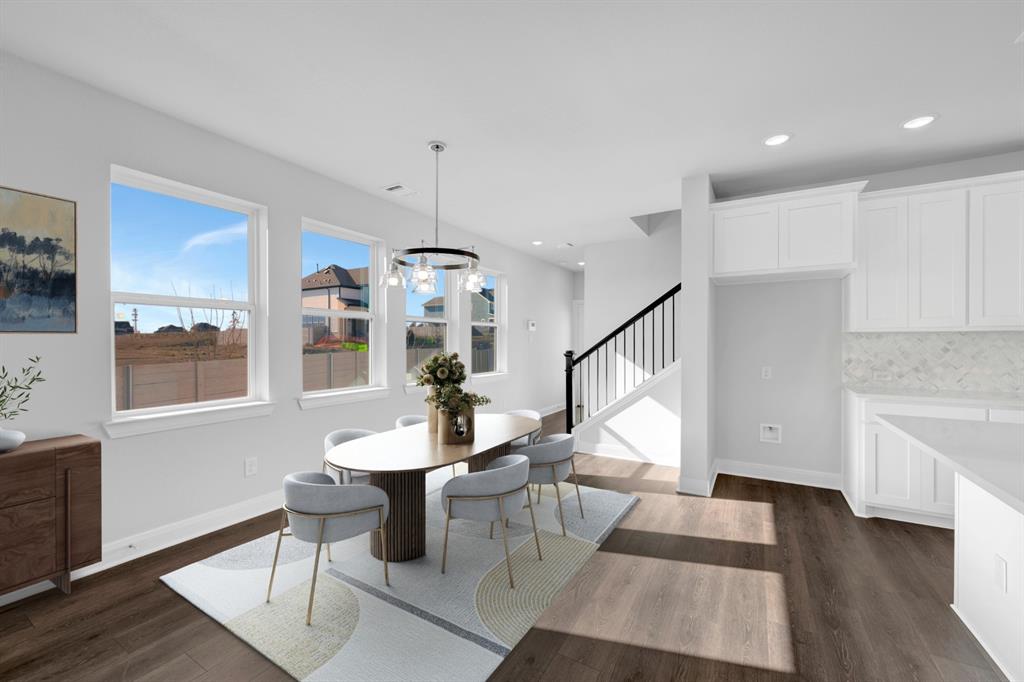 3501 Pineda Way McKinney, TX 75071 - Photo 5 of 40 a living room with furniture a dining table and a wooden floor