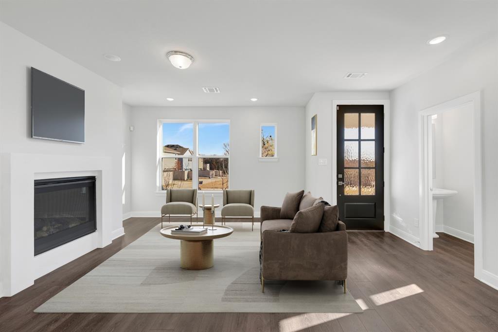3501 Pineda Way McKinney, TX 75071 - Photo 7 of 40 a living room with furniture and a fireplace